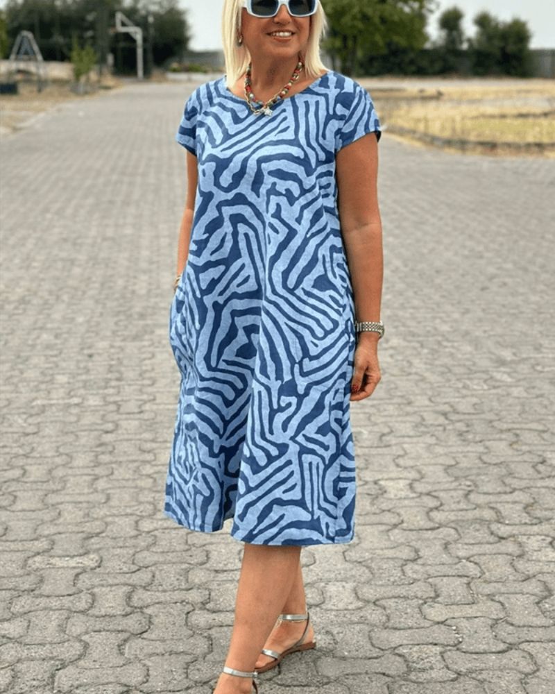 Mira™ – Zomerjurk met ronde hals en elegante print