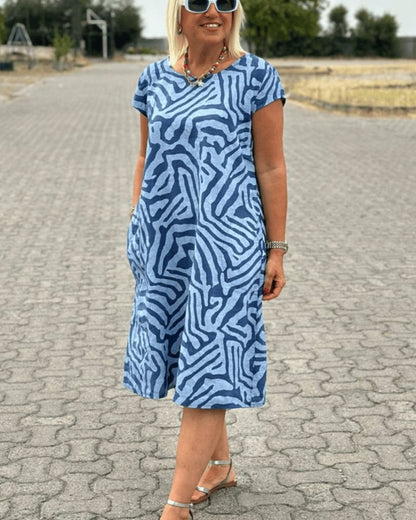 Mira™ – Zomerjurk met ronde hals en elegante print